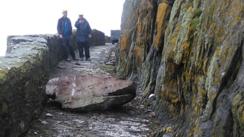 As a result of the size of the boulder the road is effectively blocked until it can be dealt with