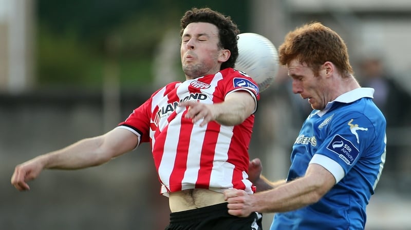 Derry's Barry McNamee and Finn Harp's Sean Houston jump for a ball at the Brandywell