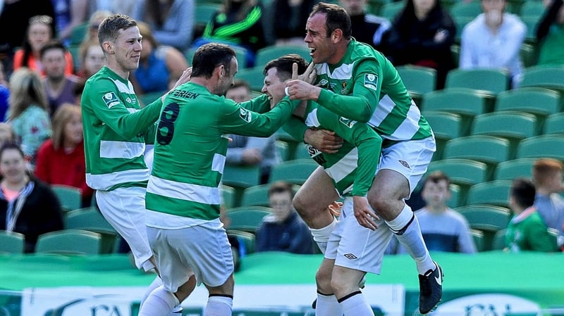 Sheriff YC players mob Mark Higgins after his headed goal