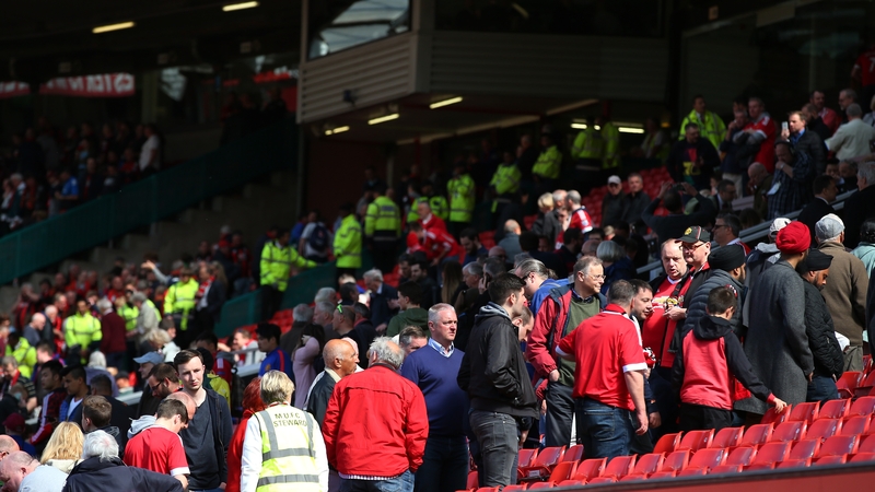 Fans leaving Old Trafford after the security alert
