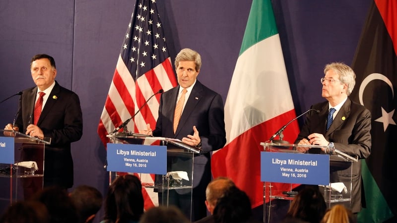 US Secretary of State John Kerry (C), Libyan PM-designate Fayez al-Sarraj (L) and Italian Foreign Minister Paolo Gentiloni (R) address a press conference in Vienna