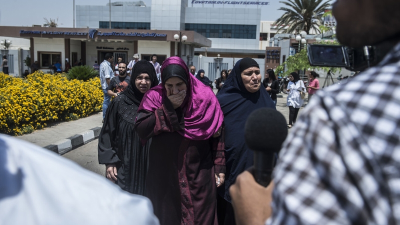Family members of missing passengers get ready to be transported by bus to Cairo airport