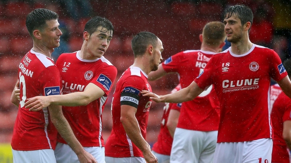 St Pat's Dinny Corcoran celebrates his goal against Pike Rovers with his team mates