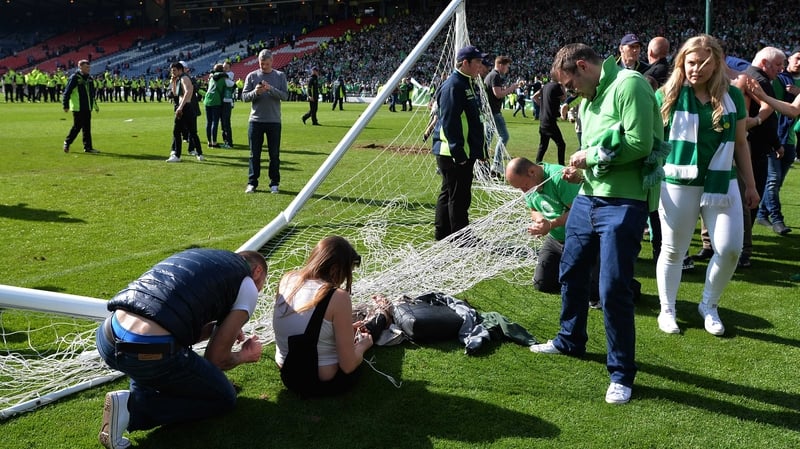 Fans streamed onto the pitch after Hibs' late victory over Rangers