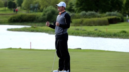 Rory McIlroy celebrates sinking the winning put on the final green at the K Club