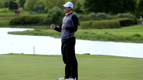 Rory McIlroy celebrates sinking the winning put on the final green at the K Club