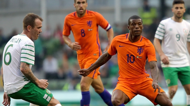 Glenn Whelan battles for possession