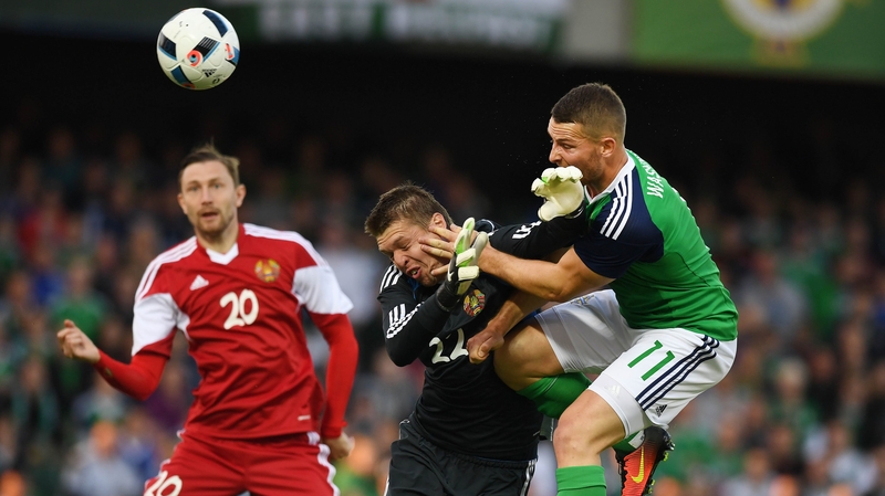 Conor Washington (R) powers home his header