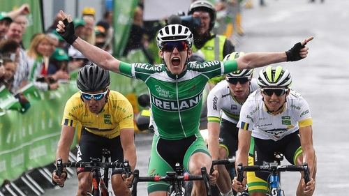 Eddie Dunbar raises his arms as he crosses the line in Baltinglass