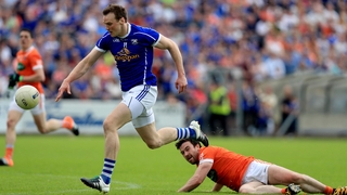 Ross McQuillan with Darragh Kennedy battle for possession