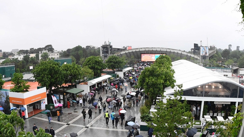 The umbrellas are out at Roland Garros, where play has been blighted by bad weather