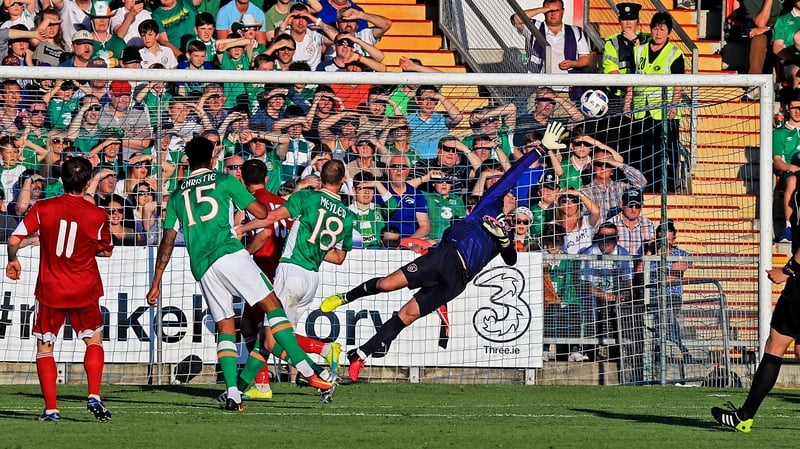 Mikhail Hardzeichuk curls beyond Shay Given