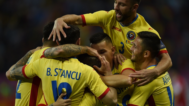 Romania players celebrate scoring