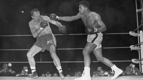 Muhammad Ali fighting British boxer Henry Cooper