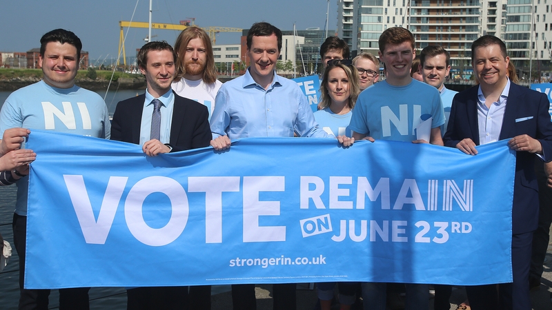 Chancellor George Osborne (C) in Belfast Harbour in Northern Ireland to meet members of the NI Stronger In campaign group who wish to remain in the EU