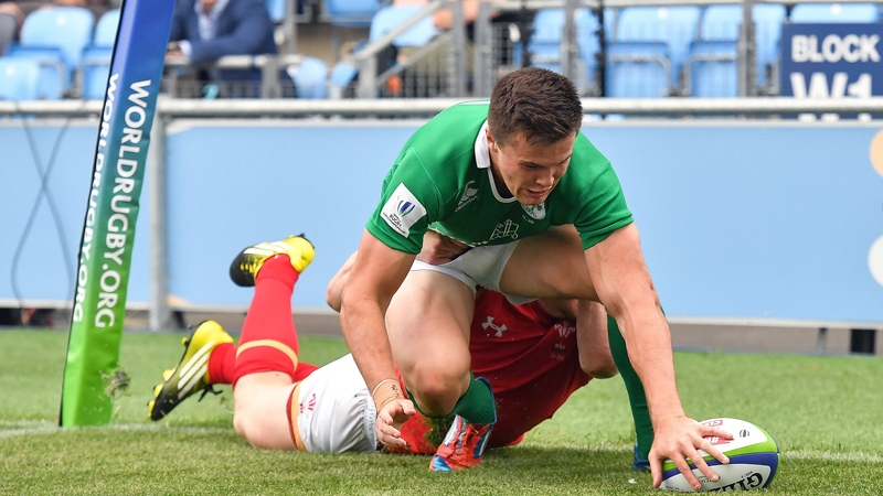 Jacob Stockdale scores one of his two tries against Wales