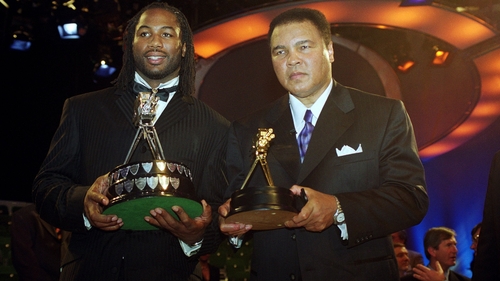 Lennox Lewis (L) and Muhammad Ali pose for the cameras at the BBC Sports Personality of the Year Awards ceremony in 1999