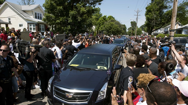 Muhammad Ali's hearse makes its way through the streets of Louisville