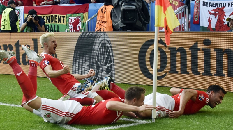 Aaron Ramsey, Chris Gunter and Hal Robson-Kanu celebrate the latter's winning goal