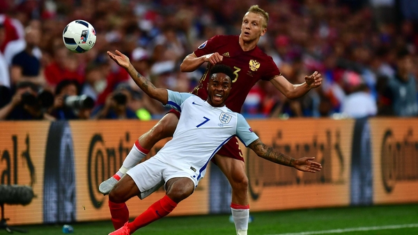 Raheem Sterling appeals for a foul with Igor Smolnikov for company