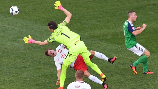 Polish keeper Wojiech Szczesny takes out team-mate Lukasz Piszczek during a rare moment of uncertainty