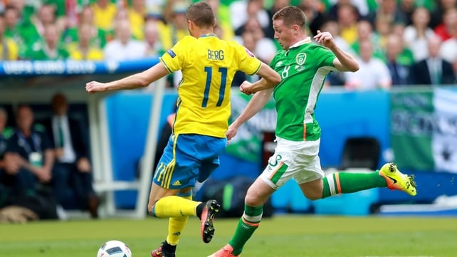 Sweden's Marcus Berg challenges James McCarthy