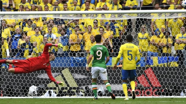 Ireland striker Shane Long watches on as a chance on the Swedish goal slips just wide