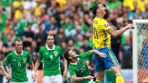 Little and large - Zlatan Ibrahimovic and Wesley Hoolahan contest an aerial ball. Zlatan had a quiet first half
