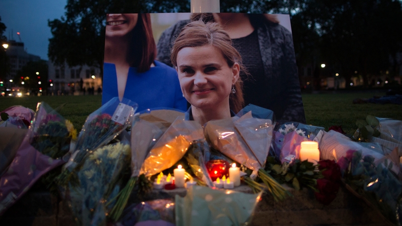 Flowers are laid at a vigil for Jo Cox in Parliament Square, London