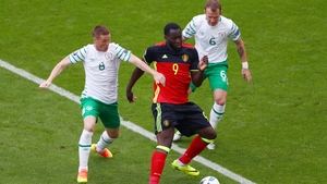 Ireland midfielders James McCarthy and Glenn Whelan pay close attention to Romelu Lukaku