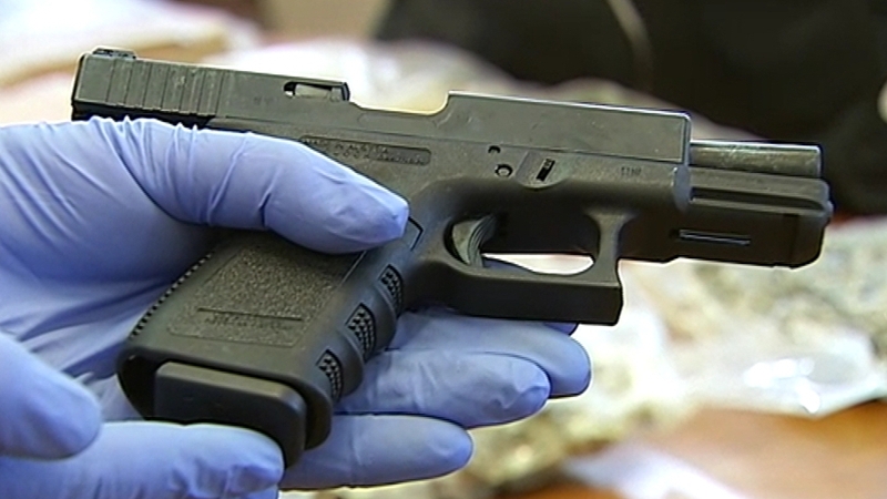 A loaded Glock 9mm semi-automatic handgun was found in one of the cars