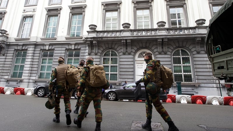 Belgian soldiers are seen on the streets of Brussels following the overnight raids