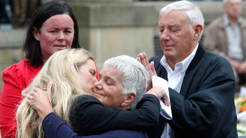 Kim and Jean Leadbeater, the sister and mother of Jo Cox, embrace as Jo's father Gordon looks on