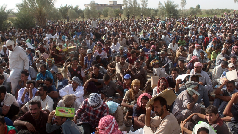 Displaced Iraqis from Fallujah rest at a safe zone after they were evacuated by Iraqi government forces