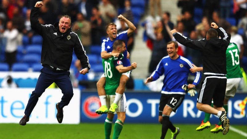 Michael O’Neill and players celebrate against Ukraine