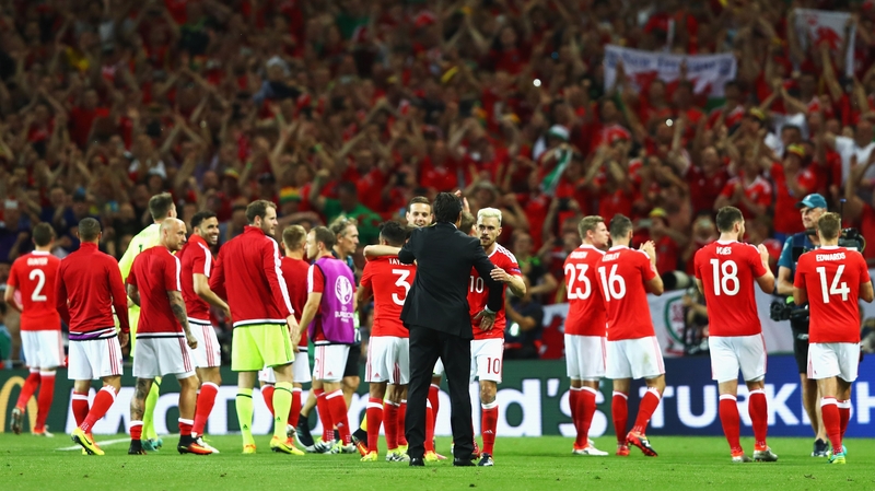 Chris Coleman celebrates his team's 3-0 win with his players