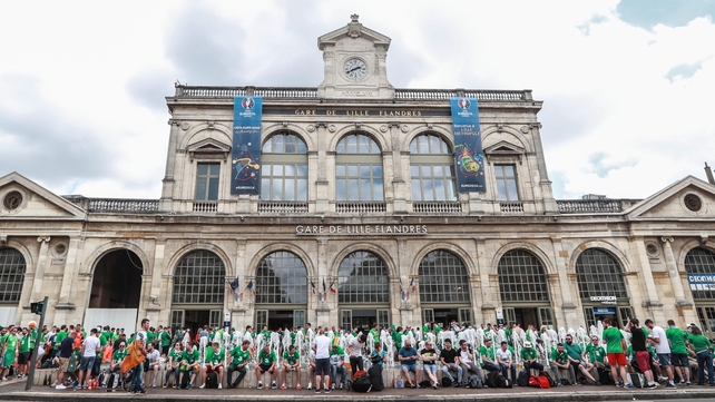 All aboard the Irish express... Ireland fans outside the station in Lille