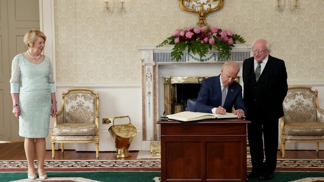Joe Biden signs the visitors' book at the State Reception Room at Áras an Uachtaráin