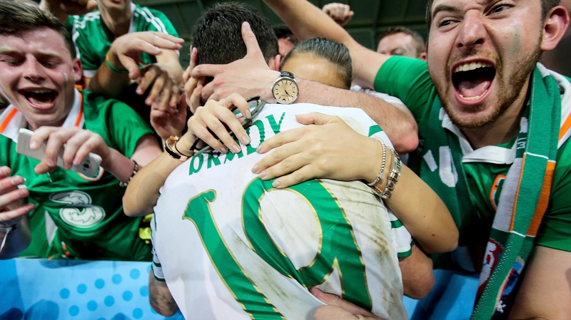 Brady celebrates with his partner and friends following the final whistle