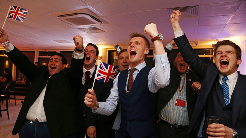 Leave EU supporters wave Union flags and cheer as the results come in at a party at Millbank Tower in central London