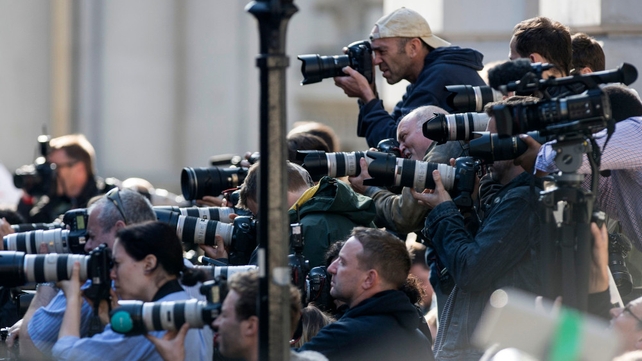 Members of the press photograph Mr Cameron as he speaks outside 10 Downing Street
