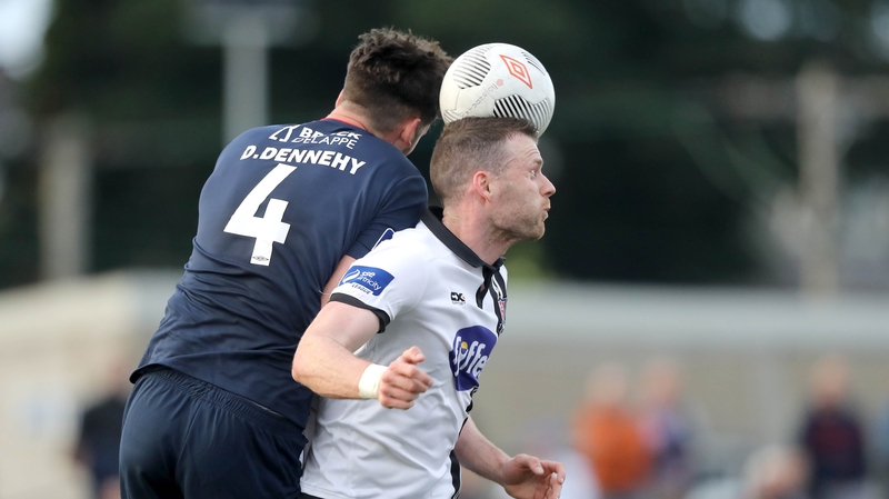 Dundalk goalscorer Ciaran Kilduff is challenged by Darren Dennehy
