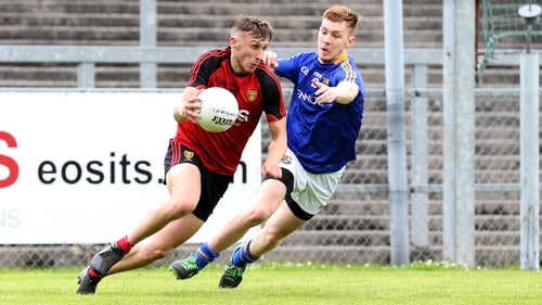 Barry O’Hagan Down and Cian Farrelly of Longford