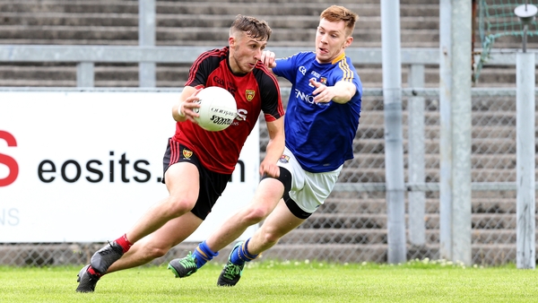 Barry O’Hagan Down and Cian Farrelly of Longford
