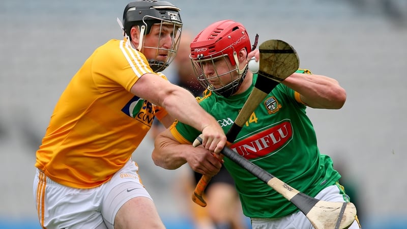 Meath’s Neil Heffernan with Tony McCloskey of Antrim