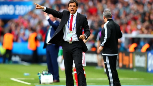 Chris Coleman barks instructions to his players from the technical area at Parc des Princes