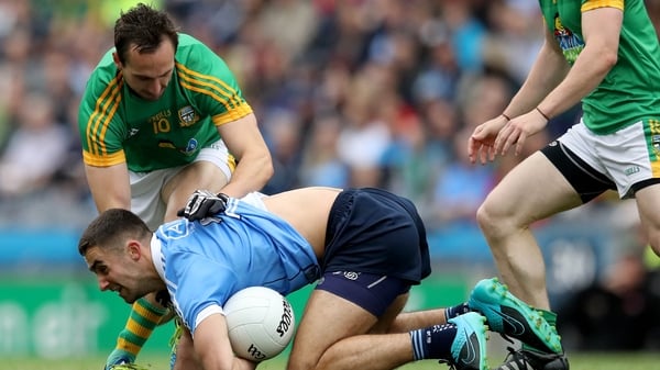 James McCarthy is tackled by Graham Reilly