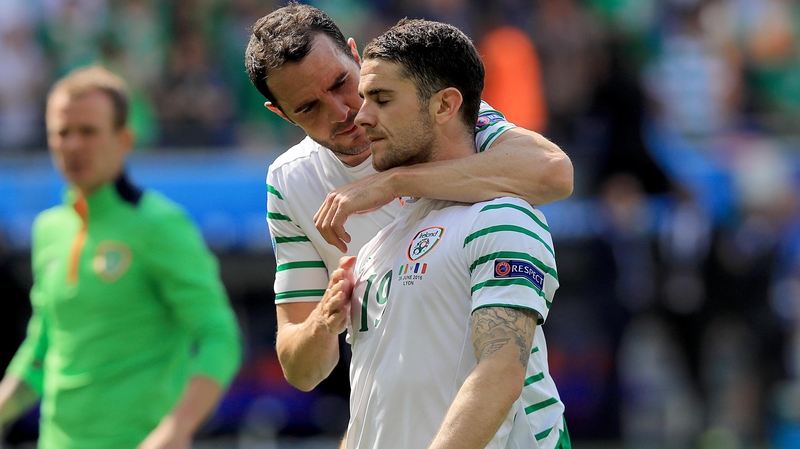 John O'Shea consoles Robbie Brady at the final whistle