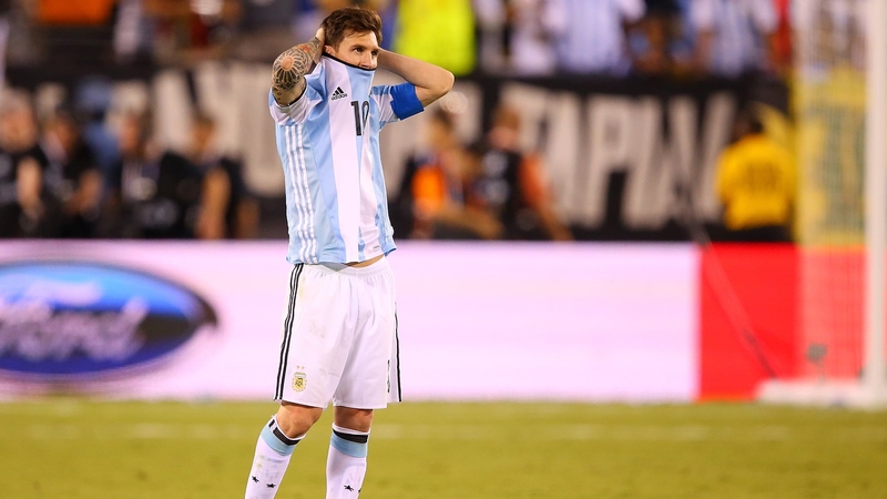 A dejected Lionel Messi looks on in the penalty shoot-out defeat to Chile