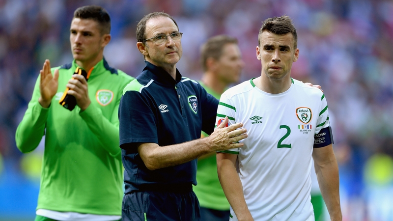 Martin O'Neill consoles his captain Seamus Coleman after the final whistle in Lyon